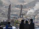 This photo, taken August 10 -- just five days after the mine collapse -- shows mine officials contemplating the rescue. [Photo courtesy of Diego Grez]