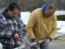 Carcia (left) and Matt Strelow, KC1XX, of XX Towers, make the final adjustments to the 40 meter beam. [S. Khrystyne Keane, K1SFA, Photo]