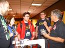 ARRL Teachers Institute on Wireless Technology Instructor Miguel Enriquez, KD7RPP (right), shows off the robot that all participants build during the four-day TI sessions.  [S. Khrystyne Keane, K1SFA, Photo]