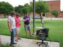 With typical student ingenuity and a touch of "Texas Field-Expedient
Engineering," Jake Rhodes, KF5HYD (left), Court Sullivan, KF5HYE (center), and James Boshart, take the prototype unit mobile for a solar drift scan. [Larry D. Barr, K5WLF, Photo]
