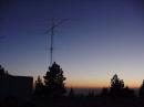 From ARRL Field Day in 1999: The antennas of W6VIO, the Amateur Radio station at the Jet Propulsion Laboratory in Pasadena, California, as the Sun sets on Mount Gleason. [Chris Carson, KE6ABQ/W6VIO Calling, photo]