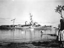 A typical Destroyer Escort, the USS Peterson, in a southern Pacific port during her tour of "Operation Deepfreeze" support duty, 23 March 1960.