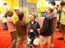 Scott Hartlage, KF4PWI, instructs visitors to the ARRL Youth Lounge how to participate in an Amateur Radio scavenger hunt. [S. Khrystyne Keane, K1SFA, Photo]