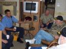 Two Newton firefighters chat during the 2007 Field Day operation with John, W0JA; Bryce, the new W0NWX, and Dean, K0JYZ. The three hams were part of the Field Day at K0JZHs barn.