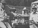 Flight Director Doc Wiley, W5OPC (left) and Communications Director Sydney Parks, WA5KGQ, pose here with the communications equipment in the gondola.