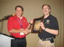 ARRL President Joel Harrison, W5ZN, presented former ARISS International Chairman Frank Bauer, KA3HDO, with the ARRL President's Award at the Dayton Hamvention. [Bob Inderbitzen, NQ1R, Photo]